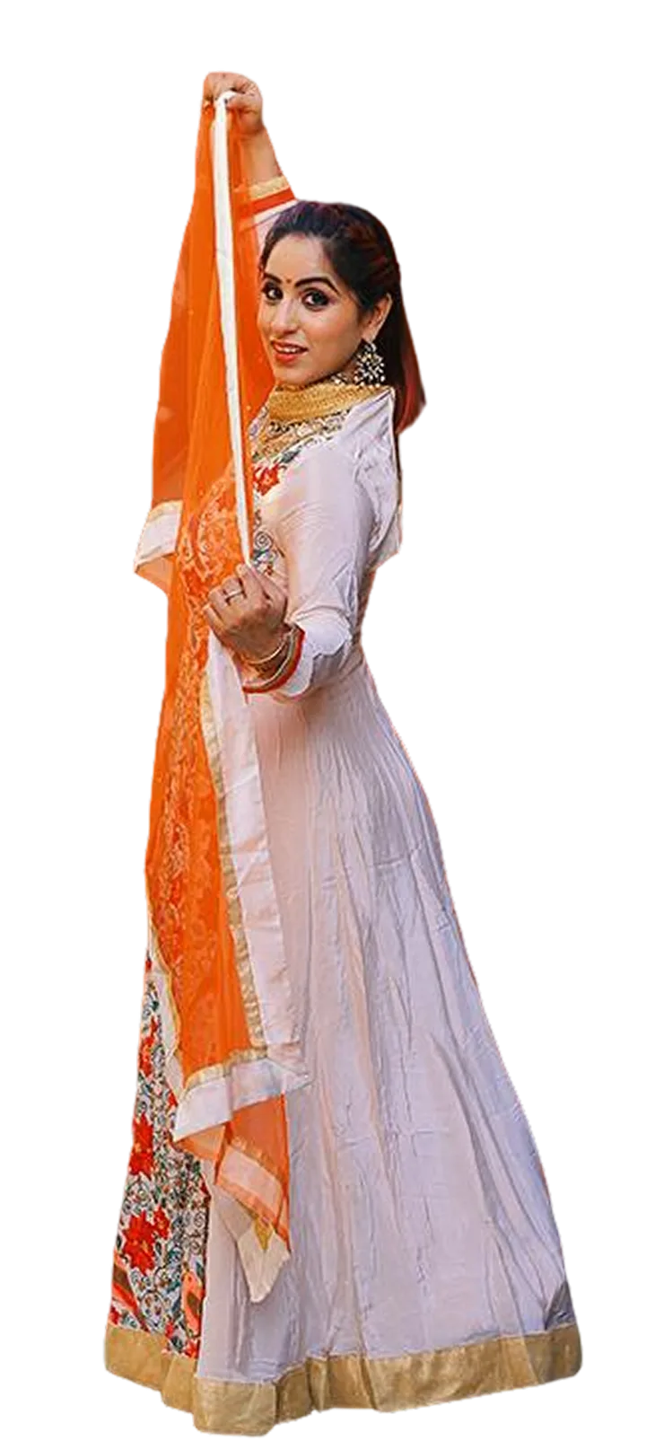 Ritika Arora in a white and gold anarkali, holding an orange dupatta overhead